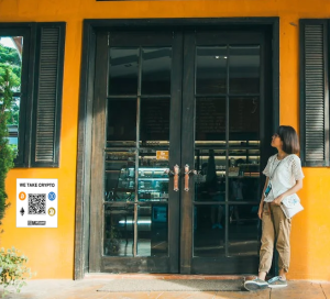 image of a store with a My Crypto Merchant sign advertising that crypto is accepted for payment